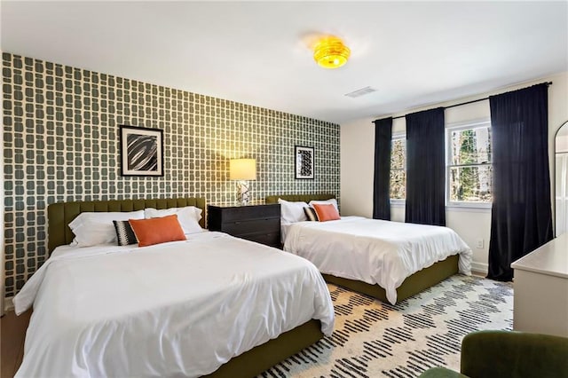5371 Tall Oak Dr, Marietta, GA 30068 - bedroom with visible vents and an accent wall