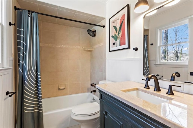 full bathroom featuring vanity, shower / tub combo with curtain, and toilet