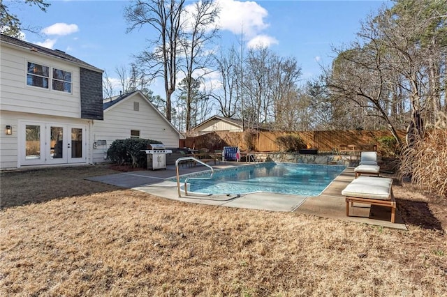 view of swimming pool with a patio area and french doors