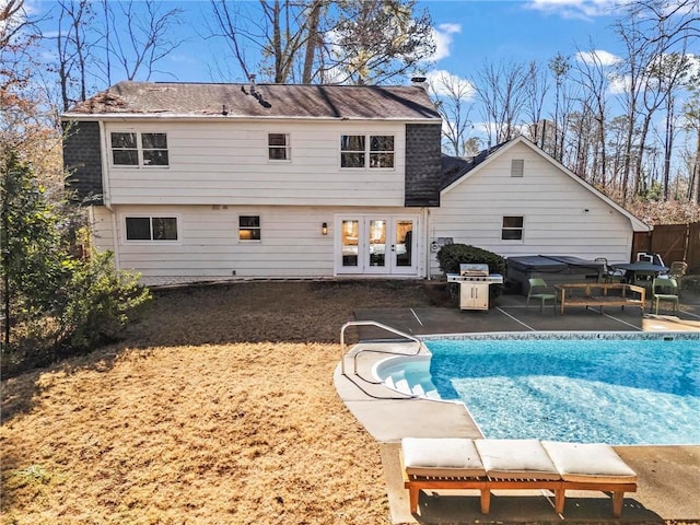 back of house with a patio and french doors