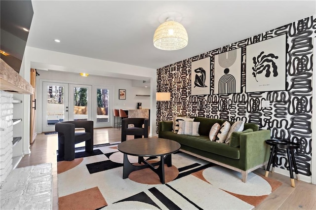 living room featuring french doors and hardwood / wood-style floors