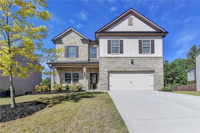 view of front of home with a garage, a front lawn, and central AC