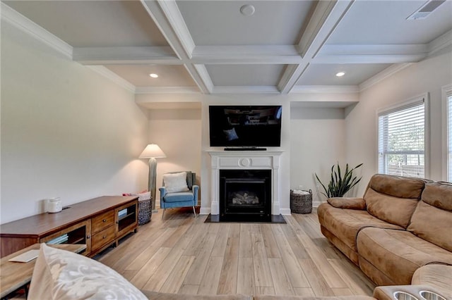 living room with ornamental molding, coffered ceiling, light hardwood / wood-style flooring, and beam ceiling