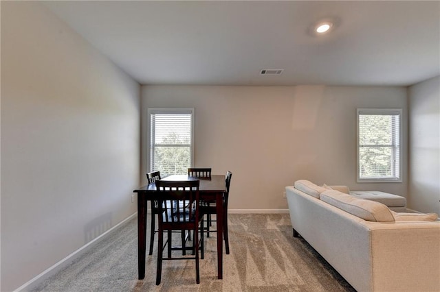 view of carpeted dining space