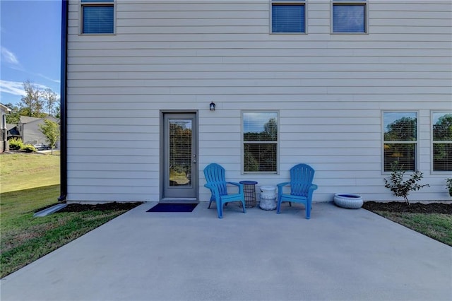 exterior space with a lawn and a patio