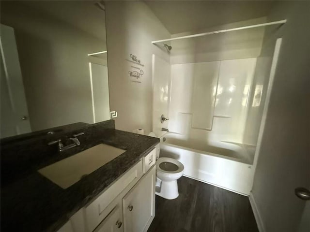6446 Grey Fox Way, Riverdale, GA 30296 - bathroom with toilet, vanity, shower / bathtub combination, and wood finished floors