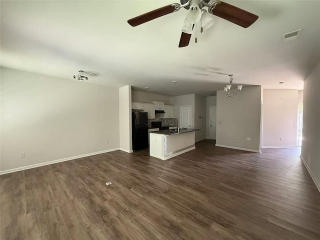 6446 Grey Fox Way, Riverdale, GA 30296 - unfurnished living room featuring a ceiling fan, baseboards, and dark wood-type flooring