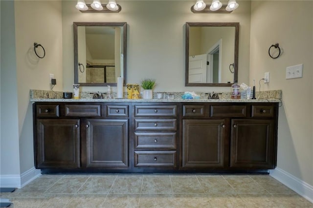 200 Baumgard Way, Locust Grove, GA 30248 - full bathroom featuring double vanity, baseboards, and a shower