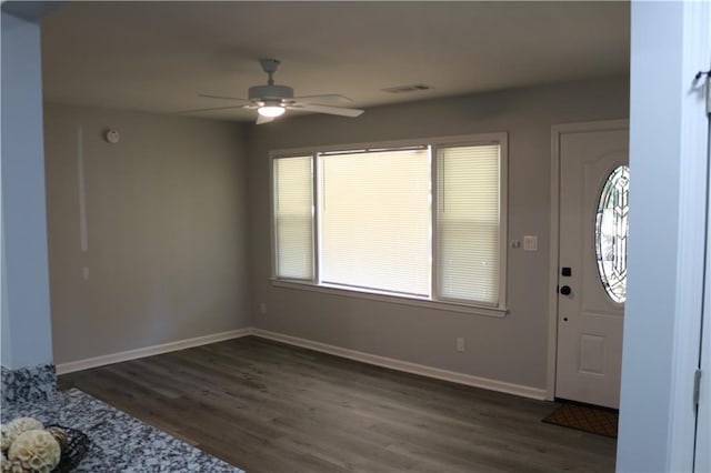 foyer featuring dark wood-type flooring and ceiling fan