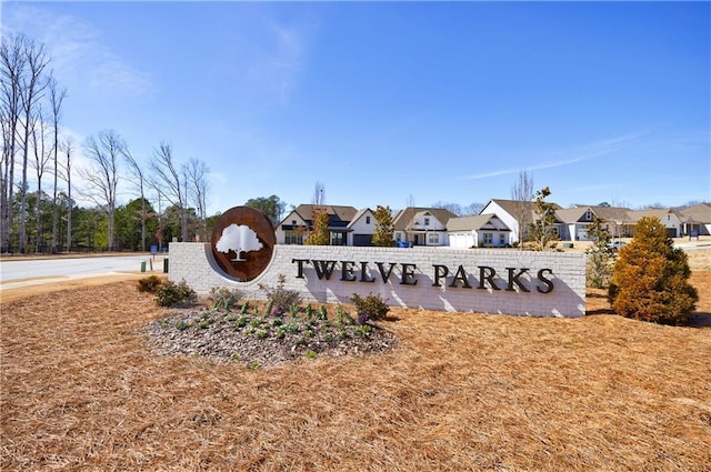 community / neighborhood sign featuring a residential view