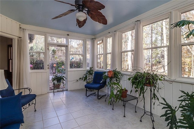 sunroom / solarium featuring a wealth of natural light and ceiling fan