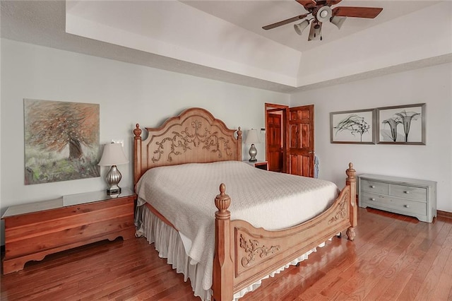 bedroom featuring ceiling fan and hardwood / wood-style flooring