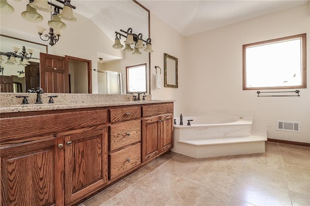 bathroom with vanity, separate shower and tub, and vaulted ceiling