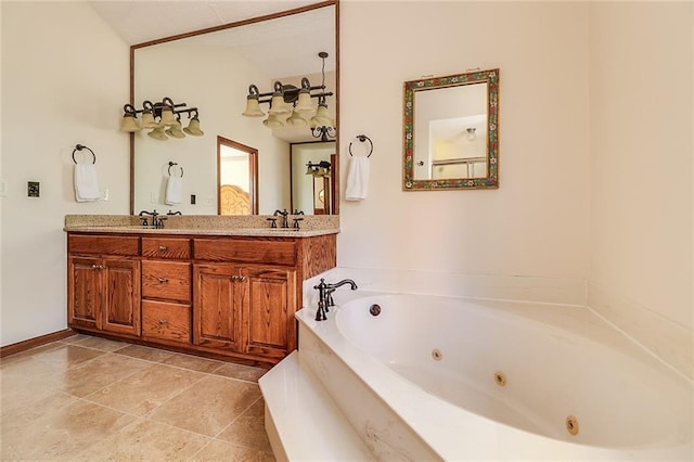 bathroom with tile patterned floors, vanity, and a bath