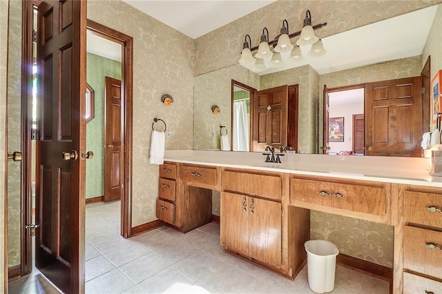 bathroom with tile patterned flooring and vanity