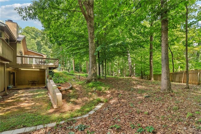 view of yard with a wooden deck