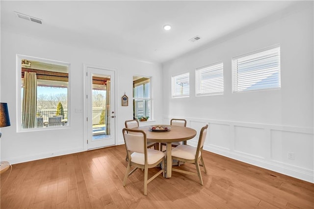 dining space featuring light wood-type flooring