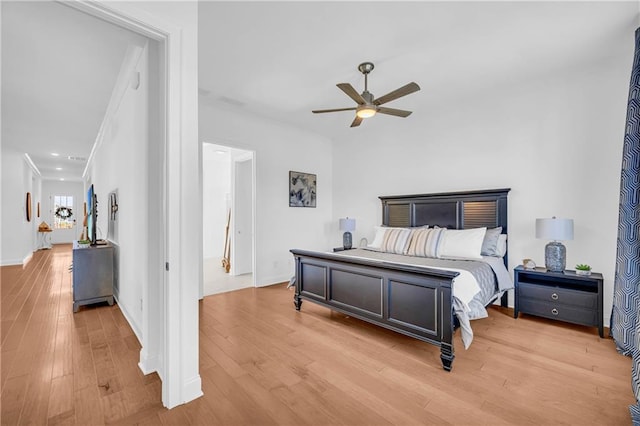 bedroom with ceiling fan and light hardwood / wood-style flooring