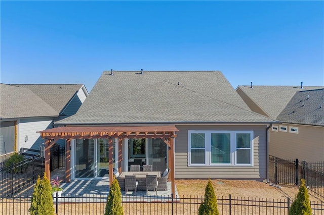 back of house featuring a patio and outdoor lounge area