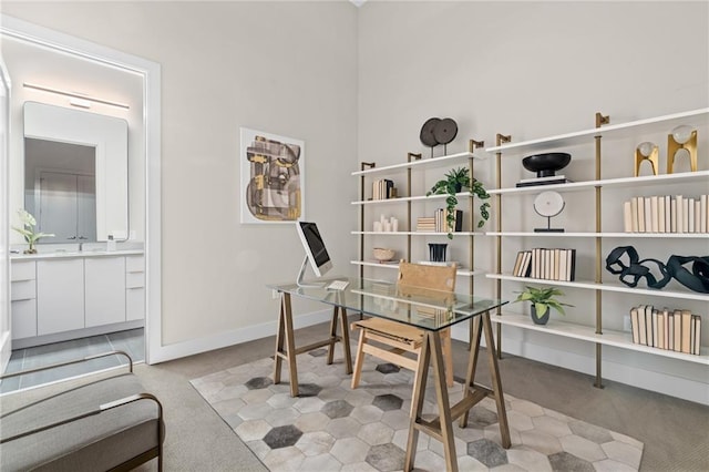 office area featuring light colored carpet