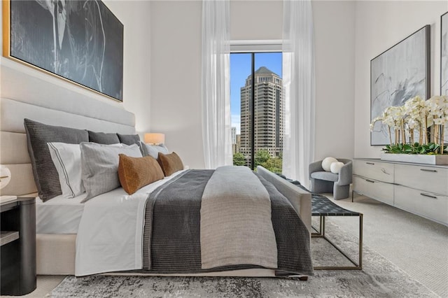 bedroom with light colored carpet