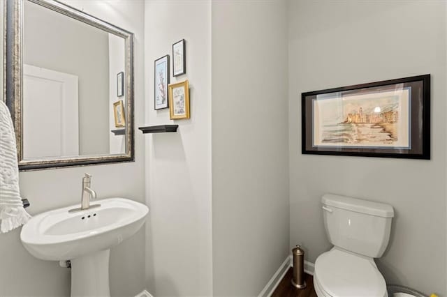 bathroom with sink and toilet