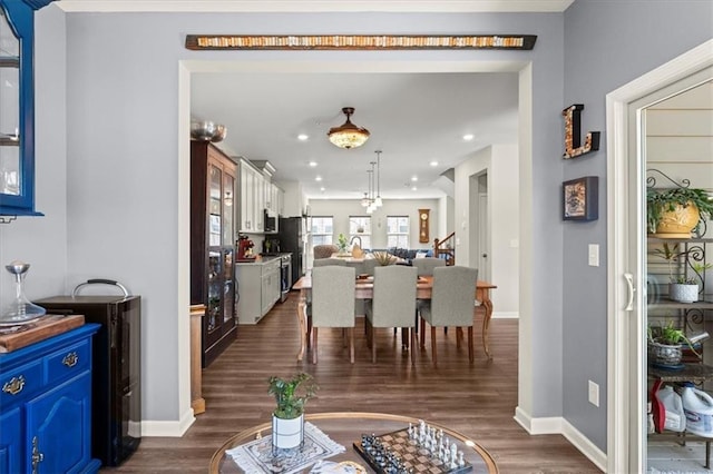 dining room with dark wood-type flooring