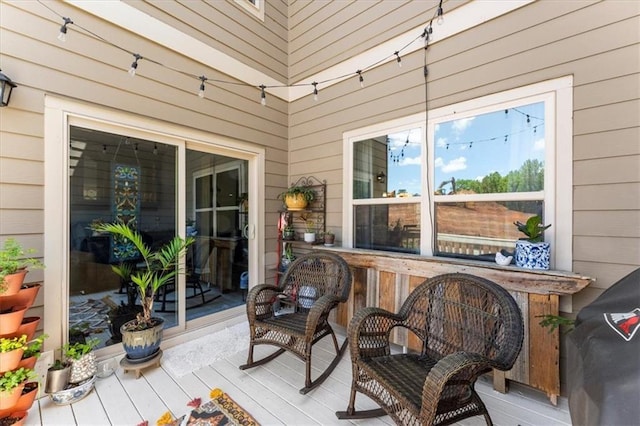 wooden terrace with area for grilling