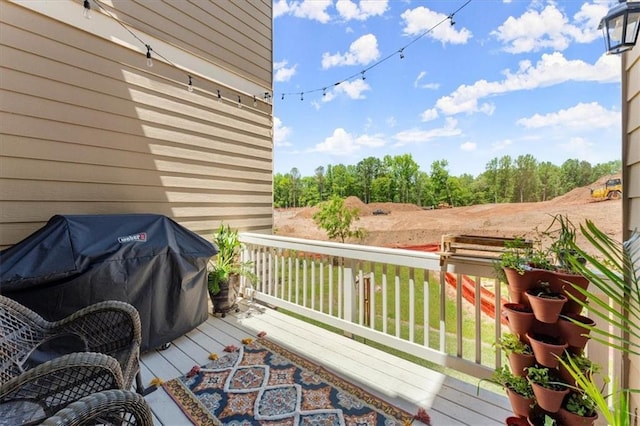 wooden terrace featuring grilling area