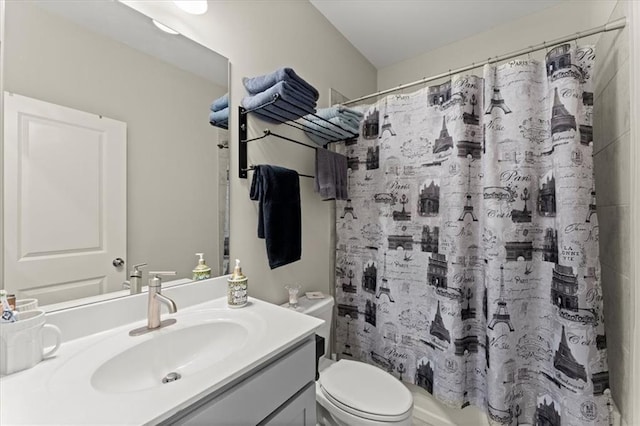 bathroom featuring toilet and vanity