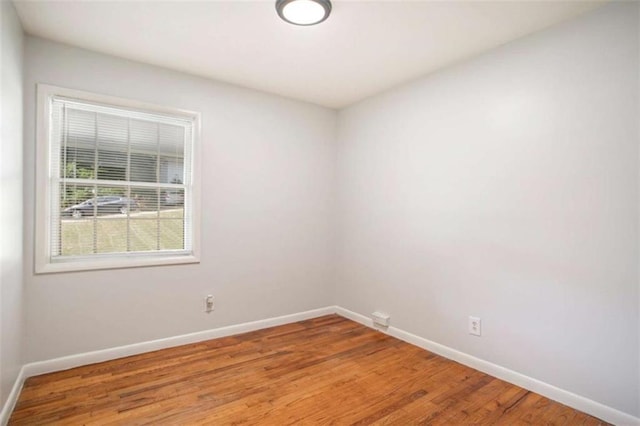 unfurnished room with light hardwood / wood-style floors