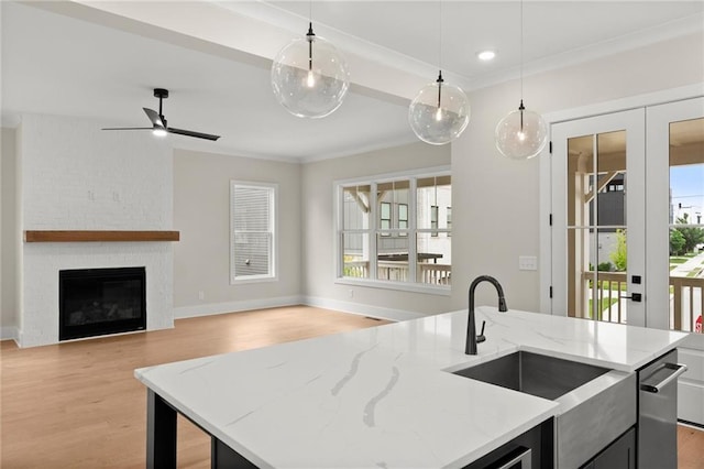 1419 Coretta Bnd, Atlanta, GA 30318 - kitchen with a sink, light wood-type flooring, open floor plan, hanging light fixtures, and an island with sink
