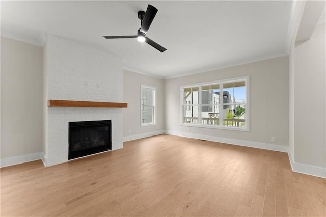 1419 Coretta Bnd, Atlanta, GA 30318 - unfurnished living room featuring crown molding, ceiling fan, light wood finished floors, baseboards, and a fireplace