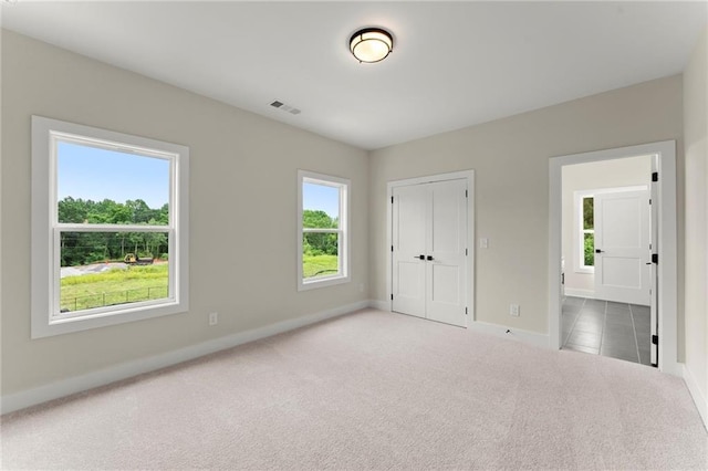 1419 Coretta Bnd, Atlanta, GA 30318 - unfurnished bedroom with carpet, baseboards, and a closet