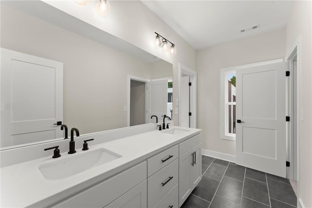1419 Coretta Bnd, Atlanta, GA 30318 - bathroom featuring double vanity, tile patterned flooring, and baseboards