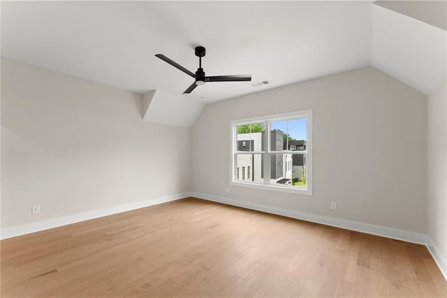1419 Coretta Bnd, Atlanta, GA 30318 - additional living space with vaulted ceiling, ceiling fan, light wood-style floors, and baseboards