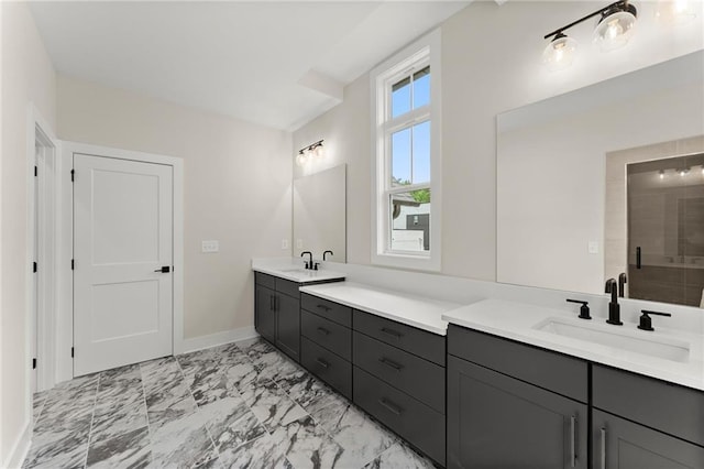 1419 Coretta Bnd, Atlanta, GA 30318 - bathroom featuring double vanity, marble finish floors, baseboards, and tiled shower