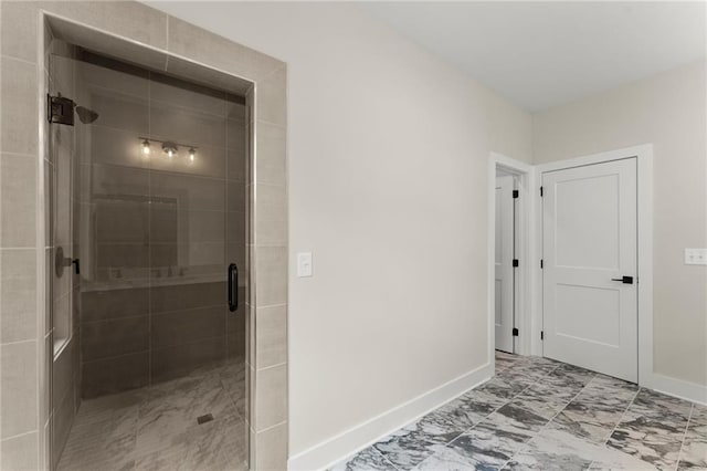 1419 Coretta Bnd, Atlanta, GA 30318 - bathroom featuring baseboards, a shower stall, and marble finish floors