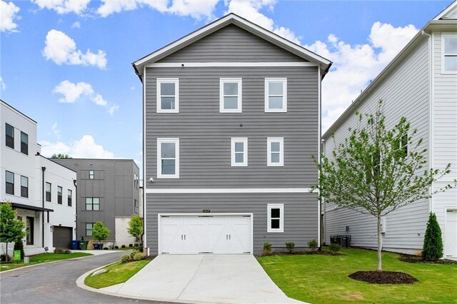 1419 Coretta Bnd, Atlanta, GA 30318 - view of front of property featuring driveway, a front lawn, a garage, and cooling unit