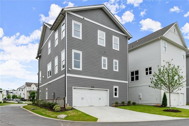 1419 Coretta Bnd, Atlanta, GA 30318 - view of home's exterior with an attached garage and concrete driveway