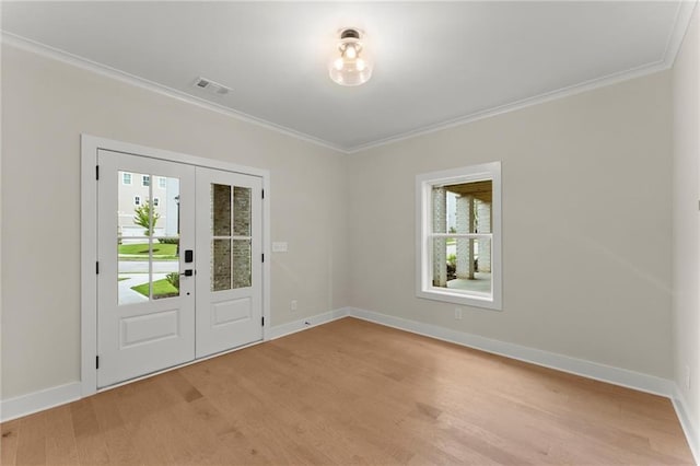 1419 Coretta Bnd, Atlanta, GA 30318 - foyer with crown molding, light wood-type flooring, and baseboards