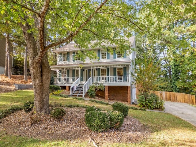 colonial home with a porch