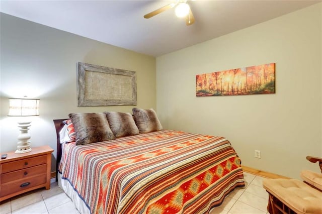 bedroom featuring ceiling fan and tile patterned flooring