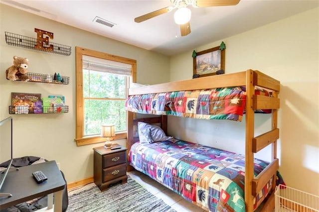 bedroom with ceiling fan, visible vents, and baseboards