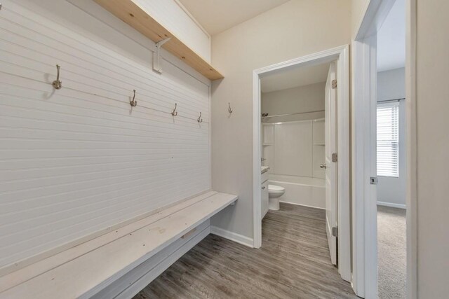 mudroom with baseboards and wood finished floors
