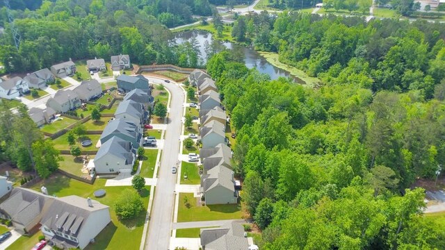 view of property location featuring nearby suburban area and a nearby body of water