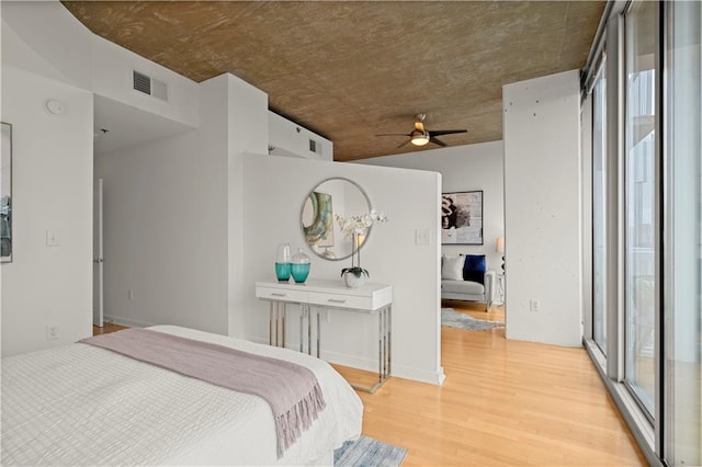 bedroom featuring ceiling fan and light hardwood / wood-style flooring