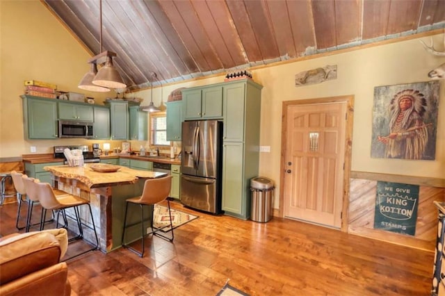 kitchen with green cabinets, wood ceiling, and stainless steel appliances