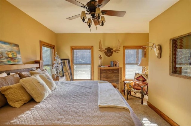 bedroom featuring carpet floors, baseboards, and a ceiling fan