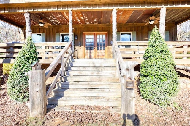 property entrance with covered porch and a ceiling fan